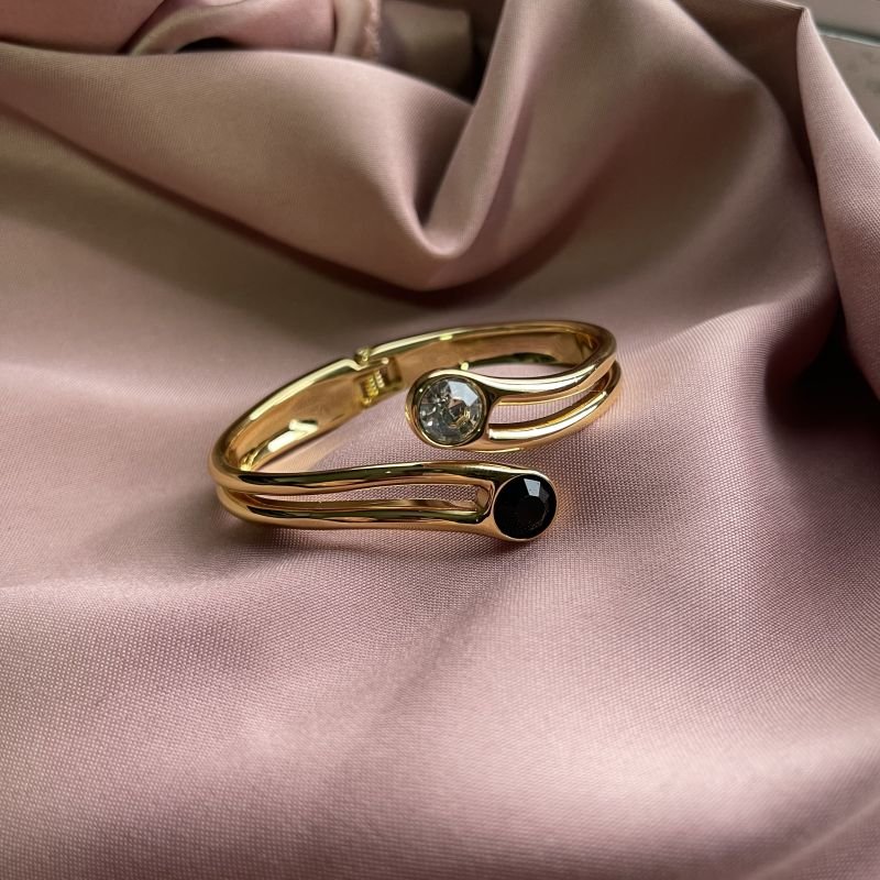 Bracelete dois cristais preto e transparente banho ouro