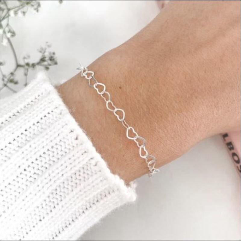 Pulseira coração vazado em aço